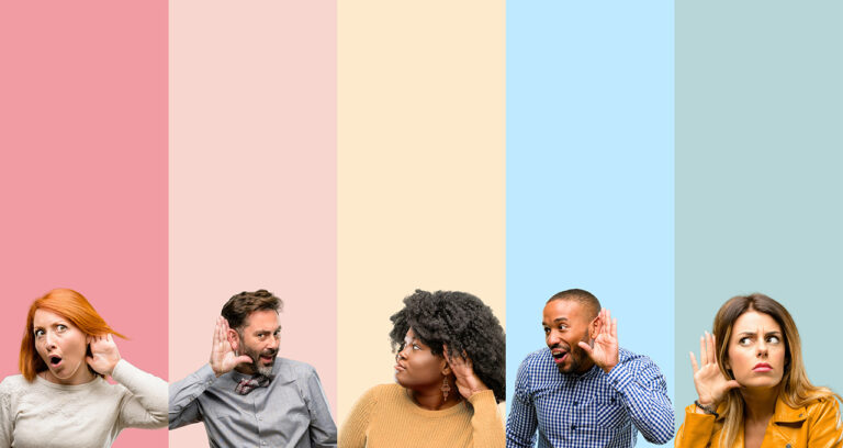 Cool group of people, woman and men holding hand near their ears trying to listen to communication from their instructor.