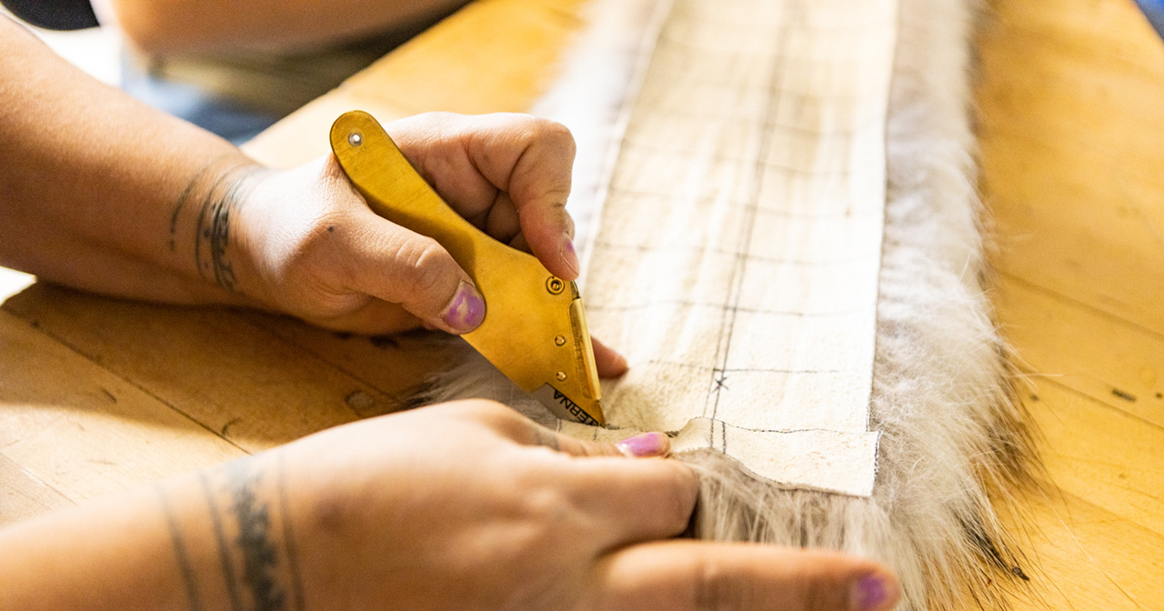 Skin sewing in the Native Arts Studio. UAF photo by JR Ancheta.